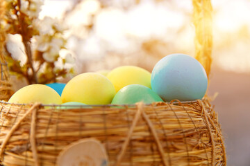 Paint eggs for Easter, bright Easter holiday, children paint eggs, colored eggs in a basket, colored eggs on a stand, Holiday background 