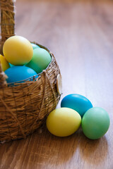 Paint eggs for Easter, bright Easter holiday, children paint eggs, colored eggs in a basket, colored eggs on a stand, Holiday background 