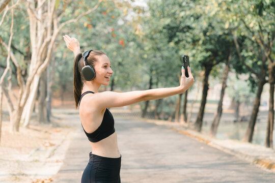 Active Selfie: A Sportswoman Capturing the Moment on Her Smartphone.