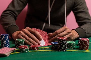 Fototapeta na wymiar man playing blackjack at the table