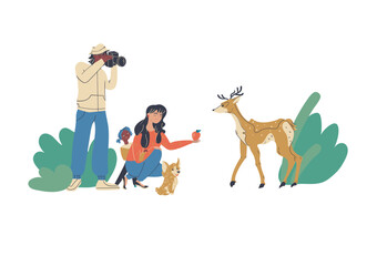 Family trip feeding a roe deer