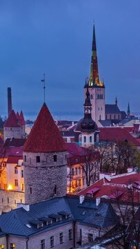 4k Timlapse of day to nigh transition of aerial view of Tallinn Medieval Old Town in evening, Estonia. Vertical video