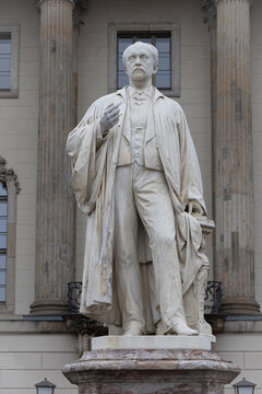 BERLIN, GERMANY-DECEMBER 23, 2022: Statue of Hermann von Helmholtz by Ernst Herter at Humboldt University of Berlin