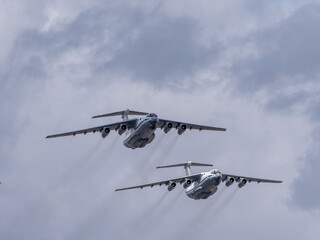 MOSCOW, RUSSIA - MAY 7, 2021: Avia parade in Moscow. Ilyushin Il-76 multi-purpose four-engined strategic airlifters fly in the sky on parade of Victory in World War II in Moscow, Russia