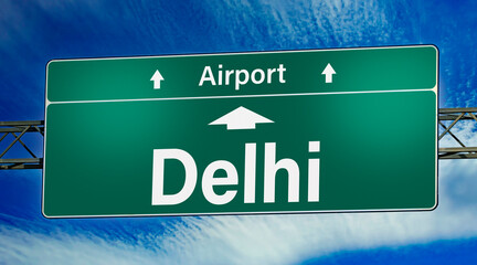 Road sign indicating direction to the city of Delhi