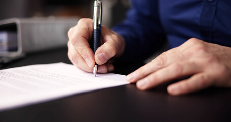 Businessman Holding Pen To Sign