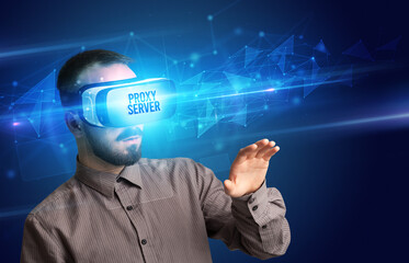 Businessman looking through Virtual Reality glasses, virtual security concept