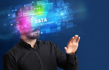 Businessman looking through Virtual Reality glasses