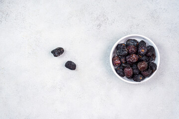 Raw Organic Arabic Dates, Ajwa Dates on light gray background. Ramadan Kareem. Top View.