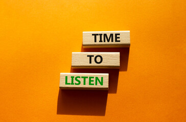 Time to listen symbol. Wooden blocks with words Time to listen. Beautiful orange background. Business and Active listening concept. Copy space.