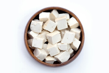 White tofu in wooden bowl on white background.