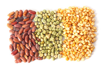 green yellow and red beans are piled on the table