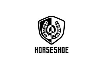 Vintage horseshoe logo design with creative shield concept