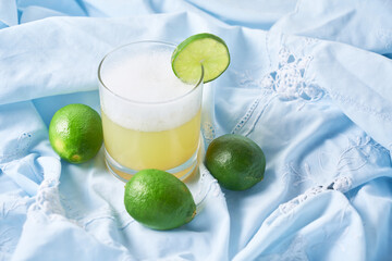 Homemade Pisco Sour Cocktail with Lime and Bitters