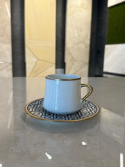 The coffee cup on the marble 