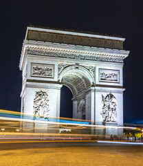 Fototapeta na wymiar Triumphal arch (Arc de Triomphe) at night, Paris, France