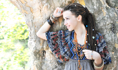 Young woman profile portrait with dreadlocks