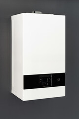 new and solid fuel boiler on grey background
