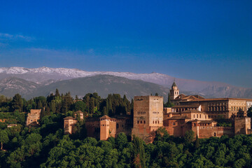 Fototapeta na wymiar Sunset over Alhambra Palace and the Sierra Nevada mountains in Granada, Andalucia, Spain