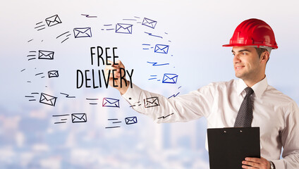 Young businessman with helmet drawing sale sign