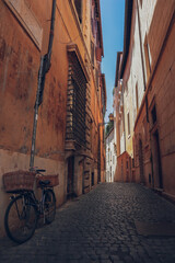 Charming tiny street alley in Rome with a bike, Italy, Lazio Trastevere, Rome        