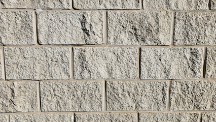 The wall is made of decorative rectangular gray stone. Stone background
