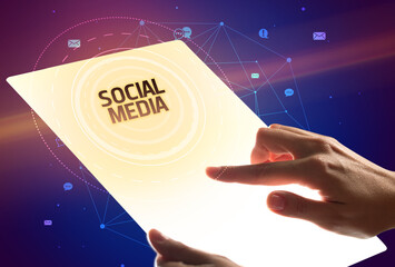 holding futuristic tablet, social media concept