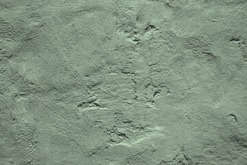 Light pale gray green uneven texture. Painted old concrete wall with plaster. Sage green color....