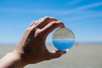 Crystal ball display a clear water and dirty water,enviroment saving, abstract meaning environment in your hand.