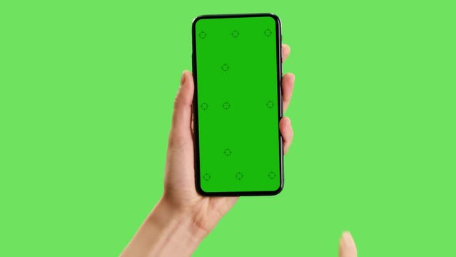 Greenscreen template for cell phone with tracking marks. The hand points once and then swipes.