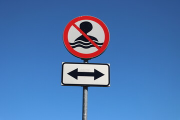 No Swimming allowed sign on the sky background