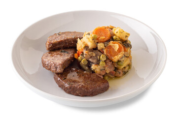 Roast hamburger with a side dish of stewed mixed vegetables, in white dish isolated