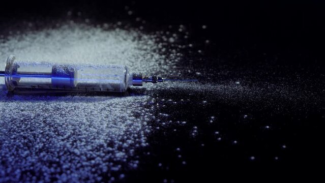 Medical syringe. Drug Addiction. White powder. Cocaine.