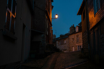 Alleyway of Domfront in Normandy, France at dusk