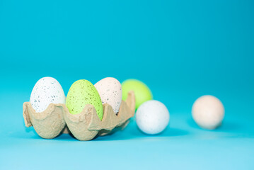multi-colored painted Easter eggs on a blue background