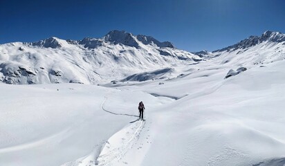 Naklejka na ściany i meble Skitour on the big mountains above davos with a view of the Flüelapass hospiz. Flueela pass. Ski mountaineering in a breathtaking winter landscape. High quality photo