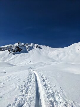Ski tracks on mountain bülenhorn monstein davos. beautiful deep snow descent in the snow. Ski touring in the breathtaking mountains. High quality photo