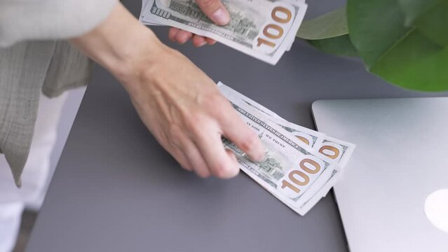 Close up woman hands counting cash money 1000 american dollars banknotes, Income, winner and Business concept.