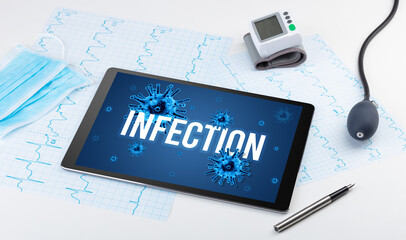 Tablet pc and doctor tools on white surface