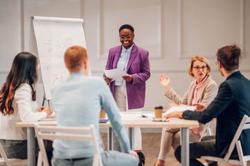 African american businesswoman holding a presentation during a meeting in an office