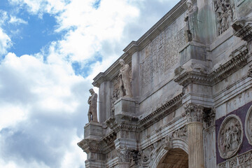 Obraz premium Detail of he Arch of Constantine (Italian: Arco di Costantino) is a triumphal arch in Rome, situated between the Colosseum and the Palatine Hill.