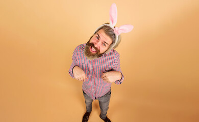 Rabbit man. Easter day celebration. Funny bearded man in bunny ears. Easter man. Bearded guy in bunny mask. Easter party. Male in rabbit ears. Spring holidays. Preparation for Easter. Spring time.