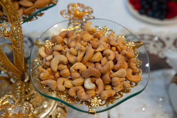 pistachion nuts on a glass plate