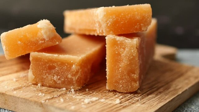  Jaggery traditional cane sugar cube on table 
