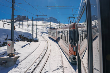 The train of Gonergratbahn running to the Gornergrat station and Stellarium Observatory - famous touristic place with clear view to Matterhorn. Glacier Express train.