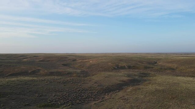 2022 - aerial over the vast dry barren flat prairie lands near Great Bend, Kansas.