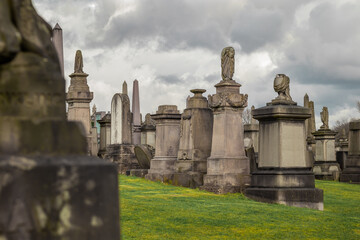Glasgow necropolis on a cloudy and sunny day, large picturesque graveyard on a hill above Glasgow with many magnificent tombstones