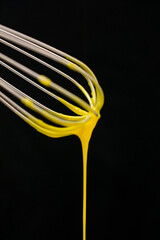Pastry cream on black background. Preparation of custard pastry lemon cream. Ingredient patisserie....