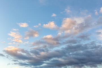 Naklejka na ściany i meble Dramatic pastel sunset sky with large clouds backdrop