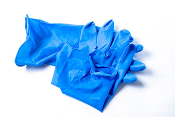 Blue rubber gloves for health protection isolated on white background. Clipping path included. Top view